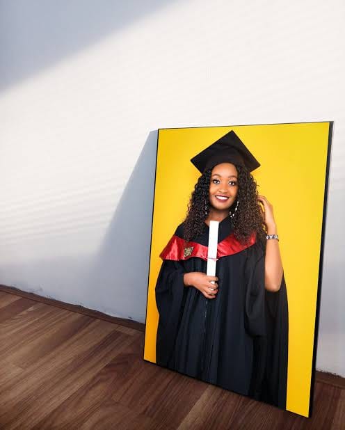 Graduation portrait in a yellow-background photo mount